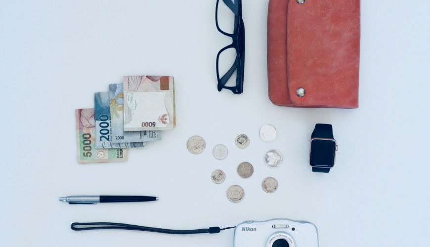 camera, pen, eyeglasses, watch, coin, and banknote